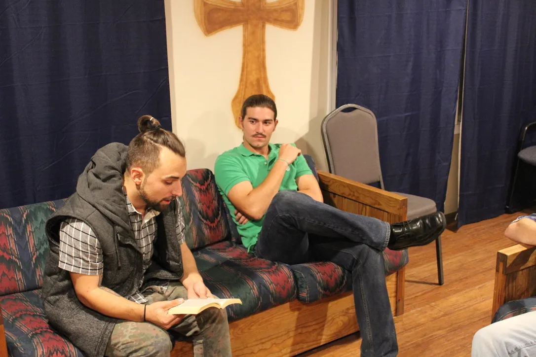 Men studying the Bible together
