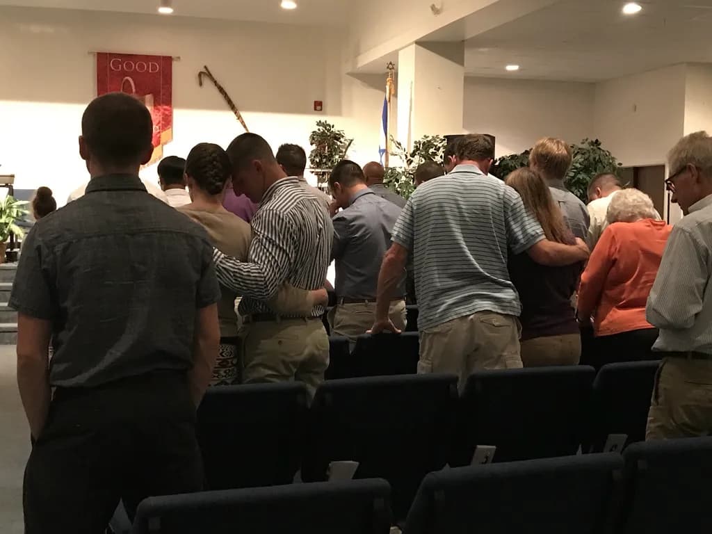Men in prayer at chapel